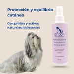 Perro de pelo largo junto al spray neutralizador de olores con prolina y activos hidratantes