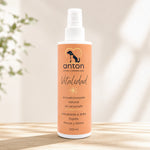 Acondicionador natural sin aclarado Vitalidad ANTON Loyal Companions para perros y gatos, hidratante y brillo, frasco de 200 ml sobre superficie de madera con luz natural.