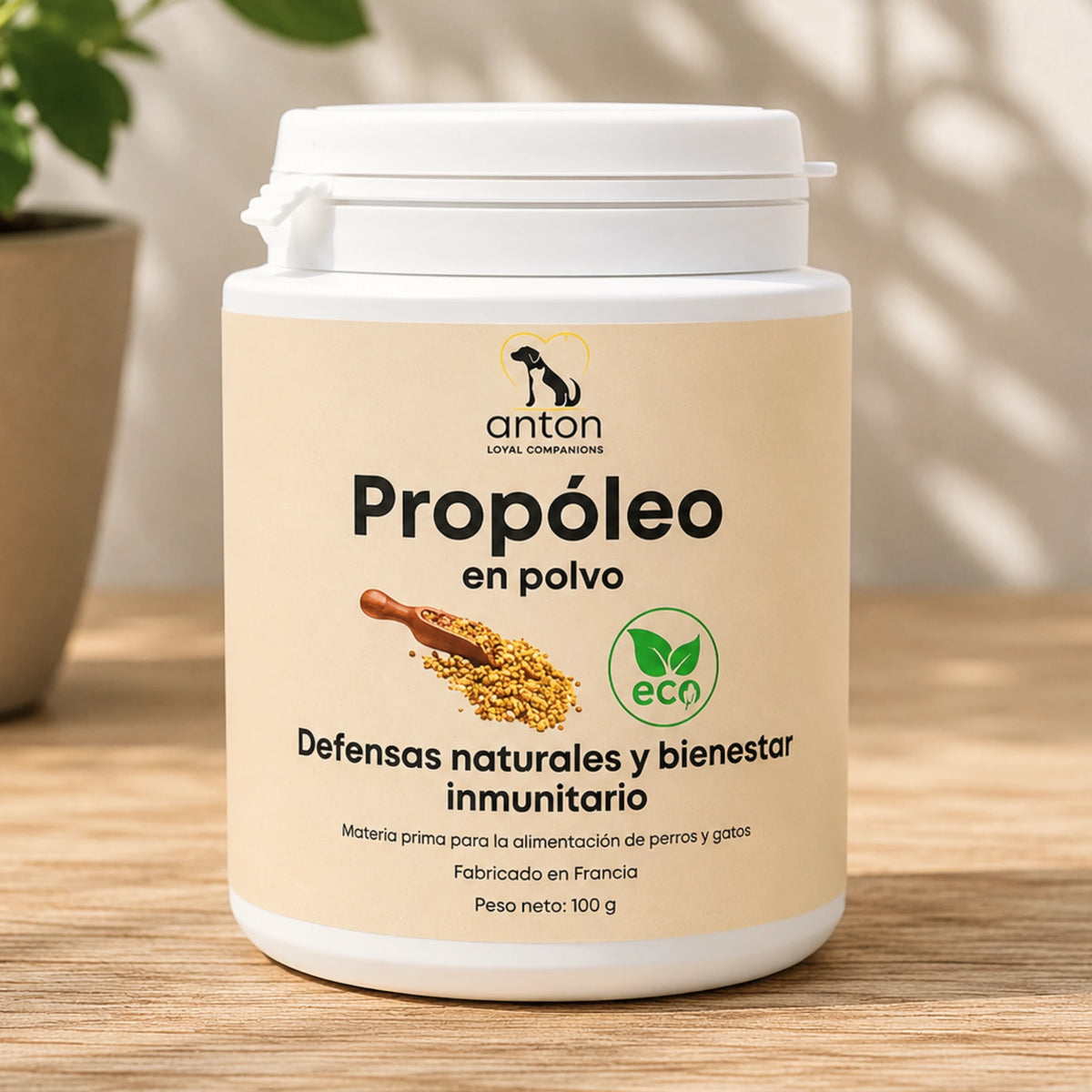 Bote de propóleo ECO en polvo ANTON de 100 g para perros y gatos sobre una superficie de madera clara.